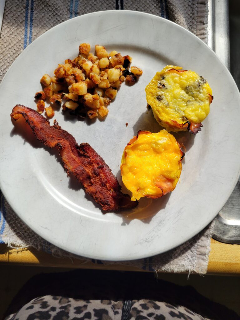 Plate with egg muffins, bacon and potatoes O'Brian