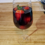 Strawberries in glass of red wine 