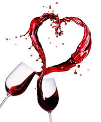 2 glasses of red wine coming together and wine spilling out of tops in shape of a heart 