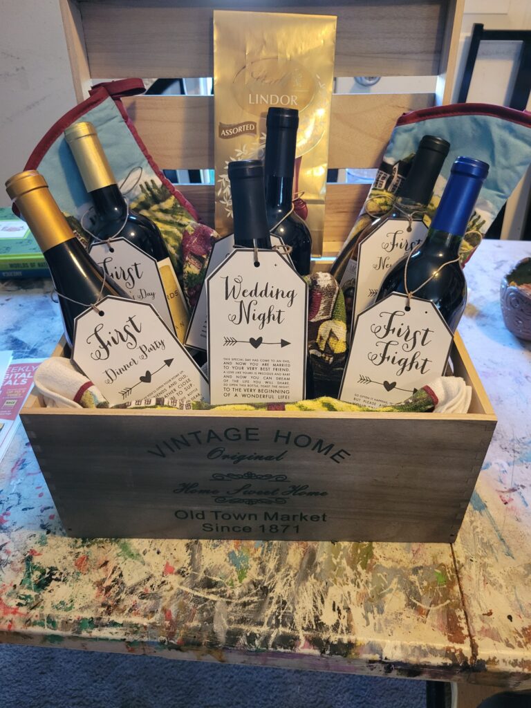 Wedding gift basket with fine wine, chocolate and kitchen towel set 